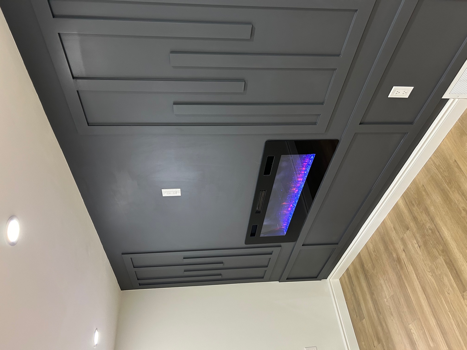 Basement with feature wall and fireplace