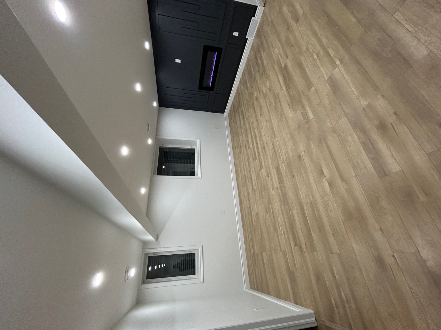 Large finished basement with potlights and wide plank floors